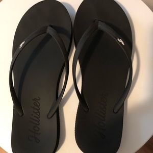 Hollister black flip flops